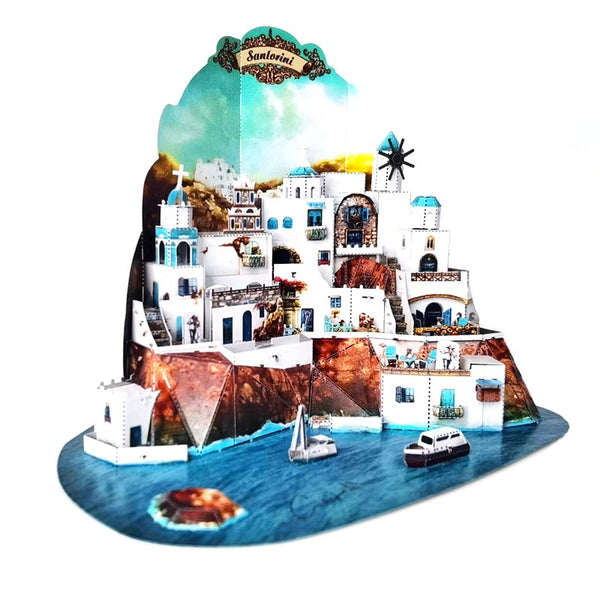 Santorini metalen architectuurmodel schuin van voren met oplopende witte huizen boven helderblauw water