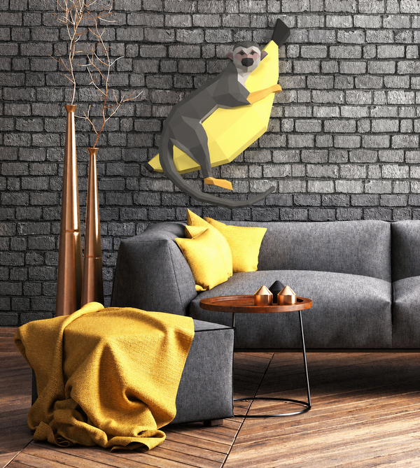 Aapje op banaan papiermodel als grote muurdecoratie in een interieur