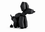 Zwarte ballonhond papercraft poepend, groot in beeld