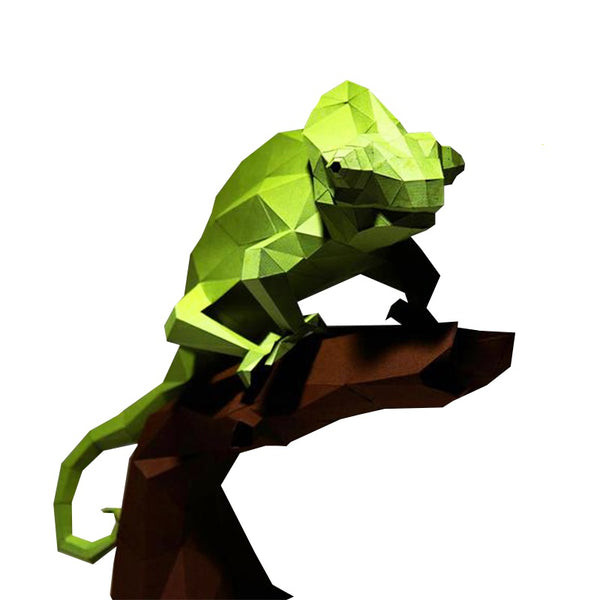 De Kameleon op Tak 3D Papier Model van SlimSpul nederland b.v. is een uitdagend reptielen bouwpakket. De low-poly kameleon zit op een bruine tak; beide zijn gemaakt van vlakke, geometrische vormen voor een uniek papercraft effect.