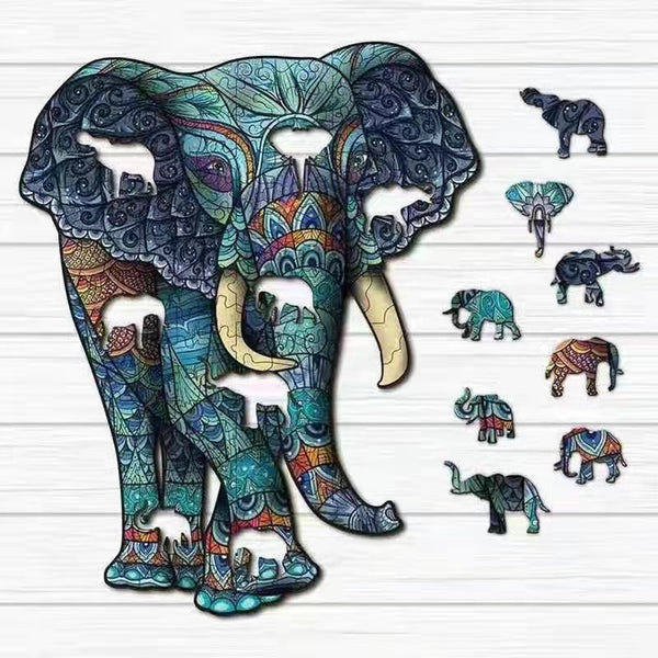 De Blauwe Olifant Houten Puzzel (A3 formaat) - Artistiek Dier Figuurpuzzel van SlimSpul nederland b.v. heeft kleurrijke patronen en bevat diverse kleine dierenfiguren, waaronder olifanten, op een witte houten achtergrond.