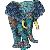 De Blauwe Olifant Houten Puzzel (A3 formaat) van SlimSpul nederland b.v. is een artistieke dier figuurpuzzel met kleurrijke patronen in blauw, groen, paars en goud-een unieke aanvulling op elke puzzelcollectie.