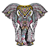 Ontdek de Olifant 2 Houten Puzzel (A4 formaat) van SlimSpul nederland b.v.- een kleurrijke, abstracte olifantenpuzzel met uniek gevormde puzzelstukjes, voorzien van geometrische en veerachtige patronen in knalroze, geel, blauw, zwart en wit.