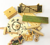 De Aardman Sleepy Farmer Houtconstructie - Beginner Model van SlimSpul nederland b.v. heeft verschillende houten onderdelen-blokken, staven, een hek, plank, ronde puzzel en cartoon schapen en honden-ideaal voor de beginnende modelbouw of het uitbreiden van je Timberkits collectie.
