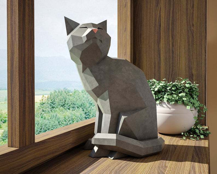 Grijze Happy Cat als tevreden zittend geometrisch 3D-papiermodel
