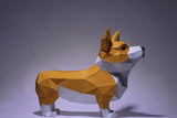 De SlimSpul nederland b.v. Corgi met Voerbakje 3D Papier Model-een charmant papieren honden bouwpakket in geel, wit en bruin-staat op vier poten tegen een effen paarsgrijze achtergrond, perfect voor hondenliefhebbers.