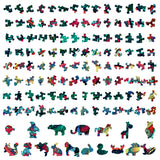 Kleurrijke puzzelstukjes van de SlimSpul nederland b.v. Kameleon Houten Puzzel (A4+ formaat) - Kleurrijk Reptiel Figuurpuzzel liggen netjes in rijen op een witte achtergrond, met levendige reptielenvormen erop.