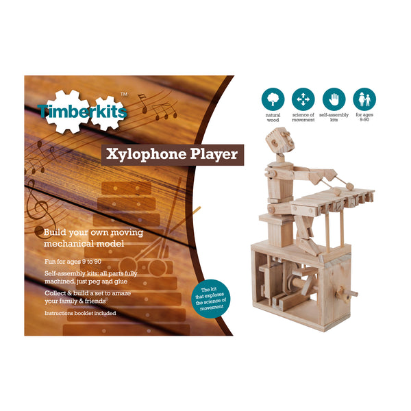 De doos Xylofoon Speler Houtconstructie - Muzikaal Bewegend Model (Timberkits) van SlimSpul nederland b.v. toont dit mechanische xylofoonspelende model, de functies en geschikte leeftijden, allemaal op een muzikale achtergrond.